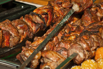 Different types of fried meat on the table. BBQ at the festival.