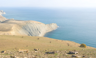 sea cape, emerald sea bay in a mist, summer sea coast scene