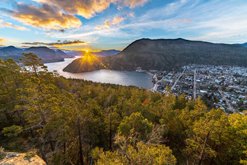 An amazing view of San Martin de los Andes town, the forest and Lacar lake in Patagonia. An amazing and inspirational road trip with awesome mountain views with huge lakes inside a extreme weather
