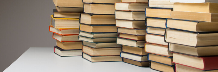 Stack of books background. many books piles.