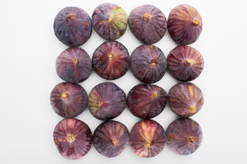 top view of ripe whole delicious figs on white background