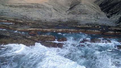 landscape and sunset on the coast contemplating the breaking of the waves on the cliffs