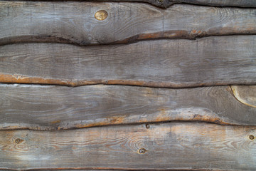 Wood background with wooden planks covering each other overlaping by side. wooden fence closeup texture.