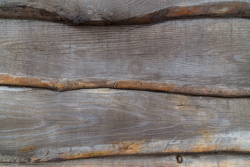 Wood background with wooden planks covering each other overlaping by side. wooden fence closeup texture.