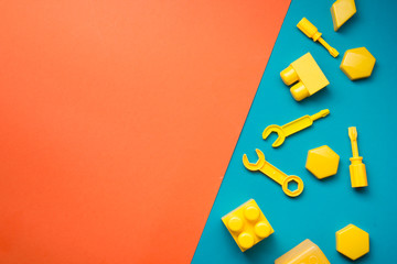 Obraz premium Colorful kids toys frame on wooden background. Top view. Flat lay. Copy space for text