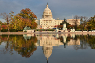 U.S. Capitol Building and water reflection in autumn foliage - Washington D.C. United States of America