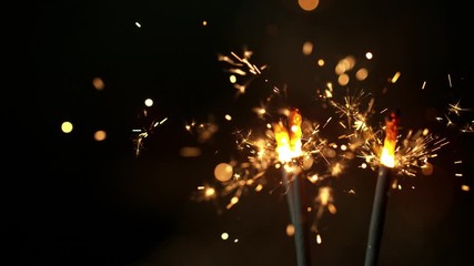 Super slow motion of burning sparklers on black background. Filmed on high speed cinema camera, 1000fps.