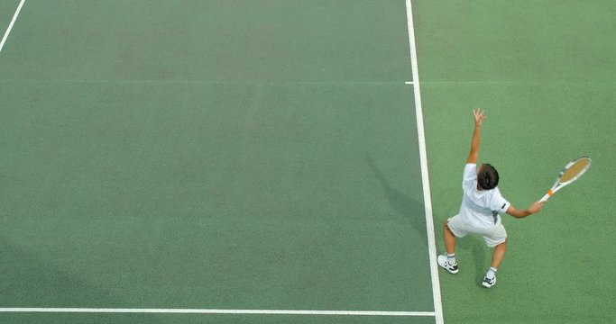 A Tennis player serves an 'Ace' and celebrates.
