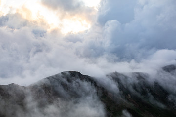 landscape with peaks covered by clouds. mountains 