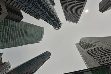 Modern skyscrapers in the financial district seen from below.