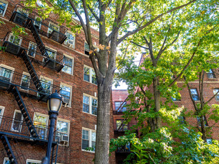 classic downtown Greenwich Village brick building facade with trees