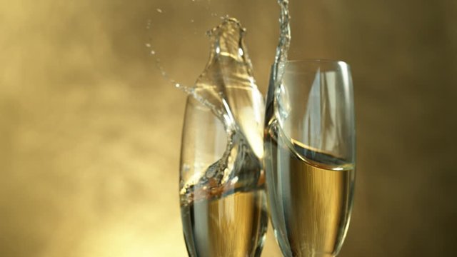 Super slow motion of having a toast with two champagne glasses. Filmed on high speed cinema camera, 1000fps