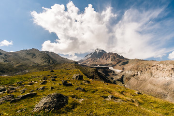 Caucasus Mountains on the border of Russia and Georgia. Very beautiful view of the Mount Kazbek, the second highest peak in Georgia with background of cloud.