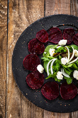 Beetroot with cottage cheese on black stone