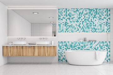 Fototapeta na wymiar White tile and blue mosaic bathroom, tub and sink