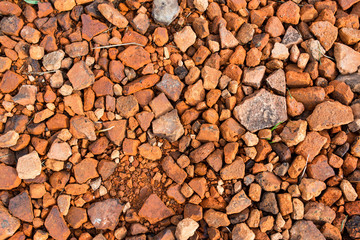 Orange broken pieces of construction bricks close up shot, image for background.