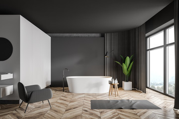 Gray and white bathroom interior with armchair