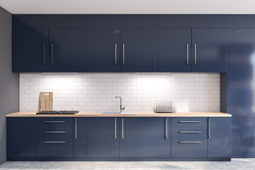 Gray and brick kitchen with blue countertops - obrazy, fototapety, plakaty