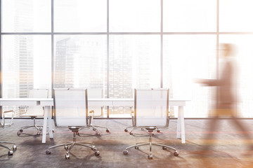 Man walking in panoramic meeting room