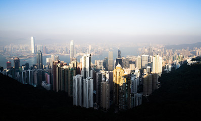 View from above, stunning view of the Hong Kong skyline during a beautiful sunset. Picture taken from the Victoria Peak. Victoria Peak is a hill on the western half of Hong Kong Island.