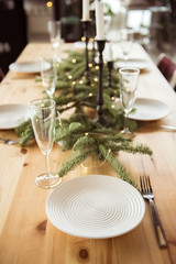 Christmas, holidays and eating concept - table served for festive dinner at home