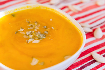 1 plate orange pumpkin osupa with seeds, vegetable autumn soup