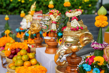 Fototapeta premium The Sacrifice objects set for the Thai filming project. They prepare in front of the spiritual landlord statue and asking for the successful project.