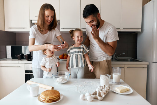attractive positive family having fun in the kitchen, lifestyle, free time, spare time. close up photo.