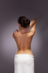 Obraz premium Woman massaging back pain