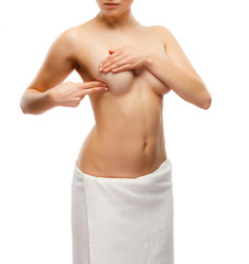 Obraz premium Woman examining breast isolated on white background