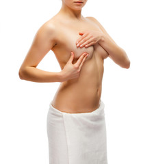 Fototapeta premium Woman examining breast isolated on white background