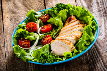 Caesar salad on wooden table