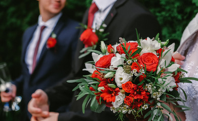 bride and groom with wedding bouquet of flowers
