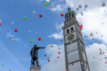 Turamichele celebration with ballons in front of Perlach tower in Augsburg, Germany, Bavaria