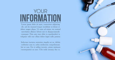 Medical Concept. Top view of stethoscope, medication, sray nose throat on blue background. Flat lay and space for text