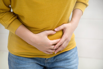 young woman having stomatch ache