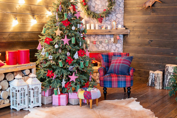 New Year's interior, holiday, Christmas, cozy and warm. Christmas tree and fireplace