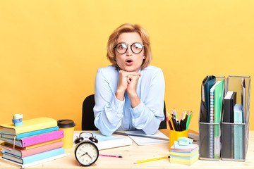 emotional secretary with wide open mouth , looking at the camera with shocked, surprised expression, reaction, facial expression