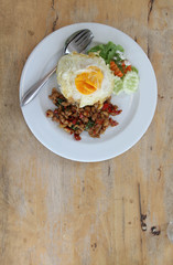 Thai food, stir-fried pork with basil and fried egg on rice