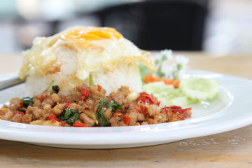 Thai food, stir-fried pork with basil and fried egg on rice