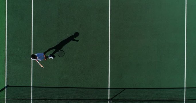A Tennis player runs across court, volleys a shot over the net and celebrates being number one.