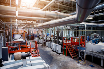 Production line of the wooden floor factory. CNC automatic woodworking machine.