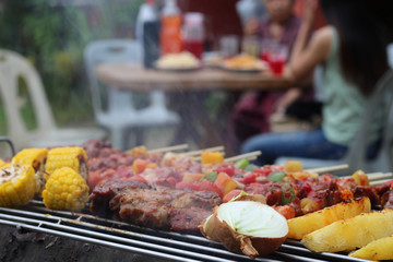 Barbeque Grill Street Food in thailand,Eat outdoors in a happy family.