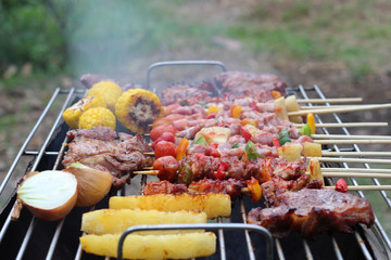 Barbeque Grill Street Food in thailand,Eat outdoors in a happy family.