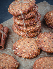 Homemade healthy oat cookies with cinnamon on brown parchment. Healthy food concept. Healthy snack