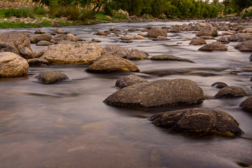 Fototapeta na wymiar Long exposure shot of Calamuchita river during summer season
