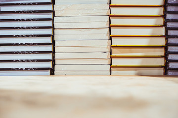 Stack of books on table, learning and education concepts. selective focus