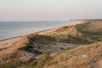 Sunset on the beach of North Zealand with sand dunes and lyme grass