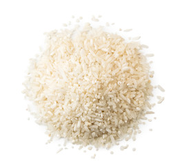 Pile of rice groats on a white background. The view of the top.