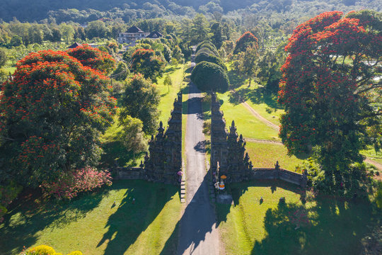 Aerial view of Bali Handara. The Hindu Temple with ancient gate with pathway in park garden at noon. Hindu architecture landscape background of travel trip and holidays vacation in Indonesia.